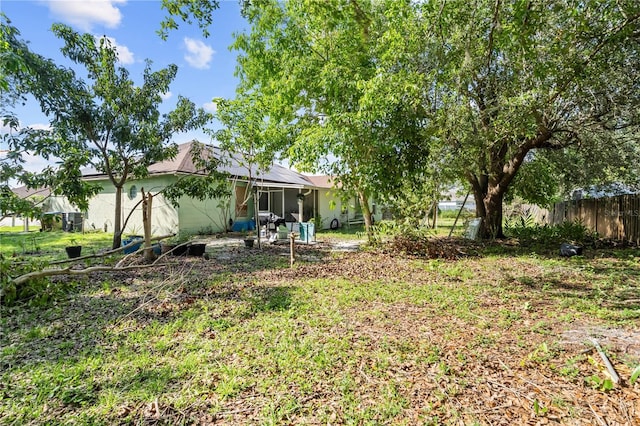 14 Sequoia Way, Kissimmee, FL 34758 - view of yard with a sunroom