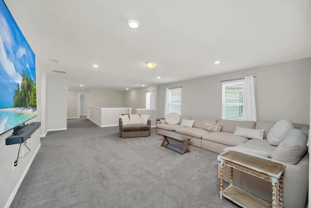 living area with carpet flooring, baseboards, and recessed lighting