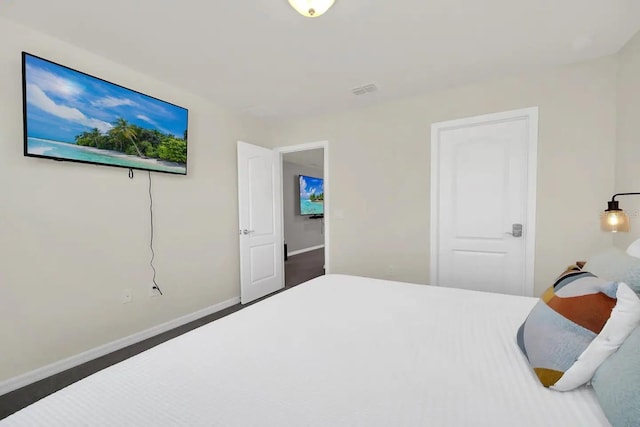 bedroom featuring baseboards