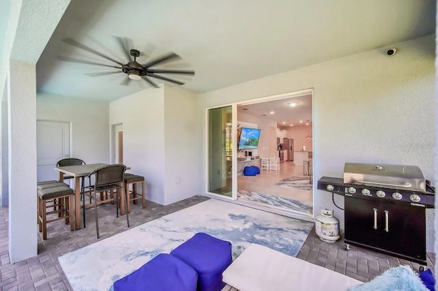 view of patio / terrace featuring ceiling fan, area for grilling, and outdoor dining space