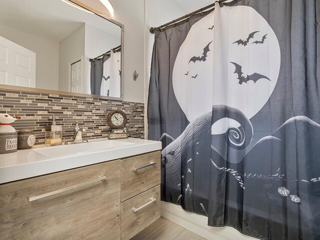 1064 Universal Rest Pl, Kissimmee, FL 34744 - full bathroom featuring vanity, decorative backsplash, and shower / bathtub combination with curtain