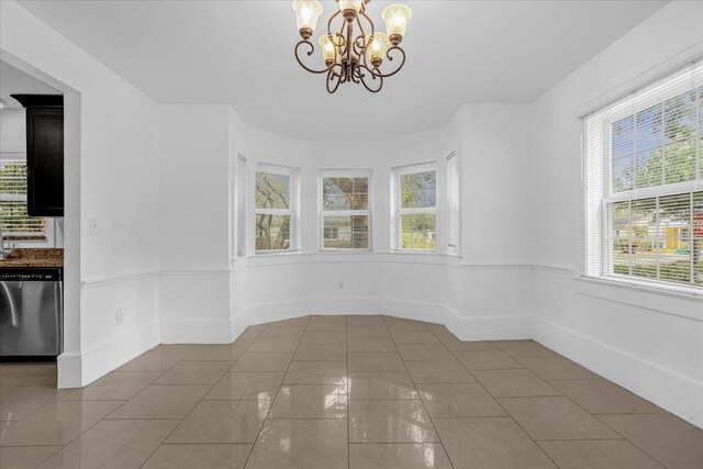 490 Shoreview Ave, Winter Park, FL 32789 - unfurnished dining area with a chandelier and tile patterned floors