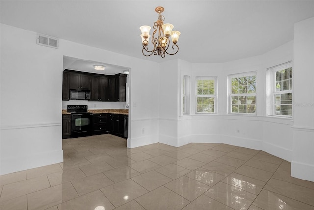 490 Shoreview Ave, Winter Park, FL 32789 - unfurnished dining area featuring a chandelier and light tile patterned floors
