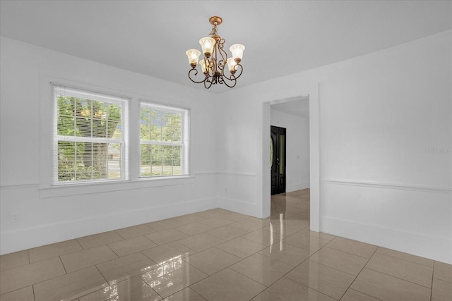 490 Shoreview Ave, Winter Park, FL 32789 - empty room featuring a chandelier and tile patterned flooring