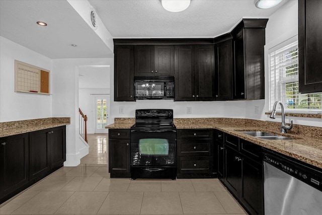 490 Shoreview Ave, Winter Park, FL 32789 - kitchen with black appliances, a sink, dark cabinetry, light stone countertops, and recessed lighting