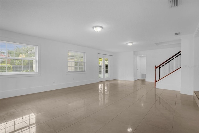 490 Shoreview Ave, Winter Park, FL 32789 - tiled spare room with stairway and baseboards