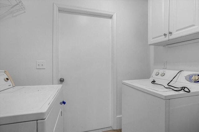 490 Shoreview Ave, Winter Park, FL 32789 - laundry room featuring washing machine and clothes dryer and cabinet space