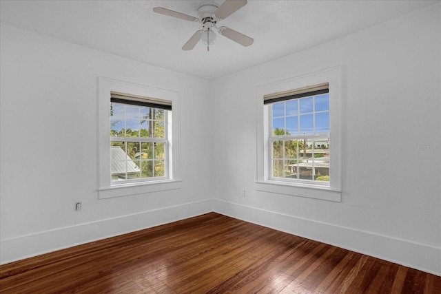490 Shoreview Ave, Winter Park, FL 32789 - spare room featuring plenty of natural light, dark wood-type flooring, baseboards, and ceiling fan