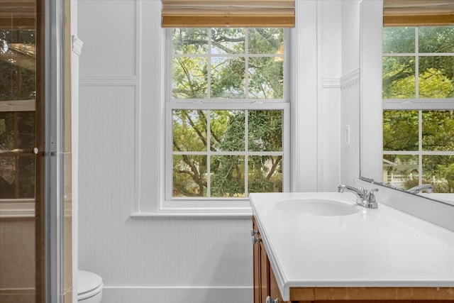 490 Shoreview Ave, Winter Park, FL 32789 - bathroom featuring vanity, toilet, and plenty of natural light