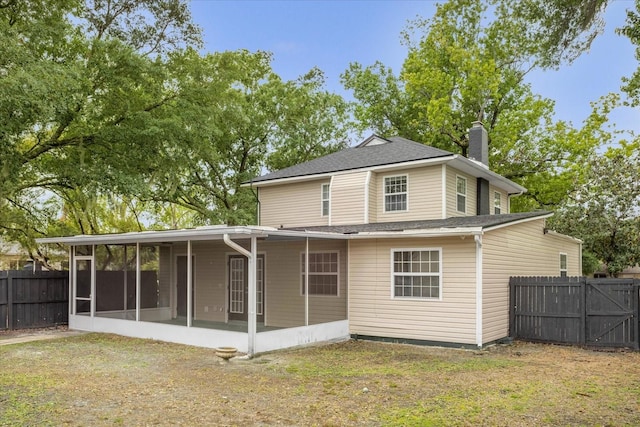 490 Shoreview Ave, Winter Park, FL 32789 - rear view of house featuring a sunroom, a chimney, and a shingled roof
