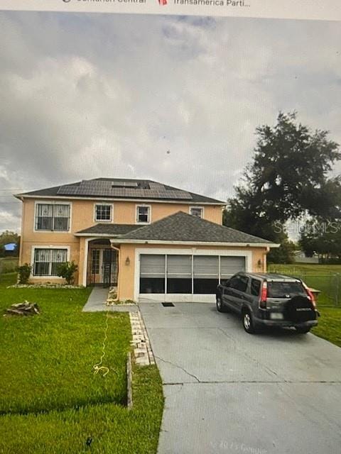 834 Oglethorpe Ct, Kissimmee, FL 34758 - traditional home featuring a garage, driveway, and a front yard