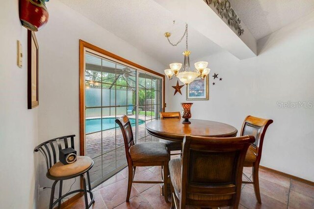 513 Sabal Trail Cir, Longwood, FL 32779 - dining area with a chandelier, a sunroom, and baseboards