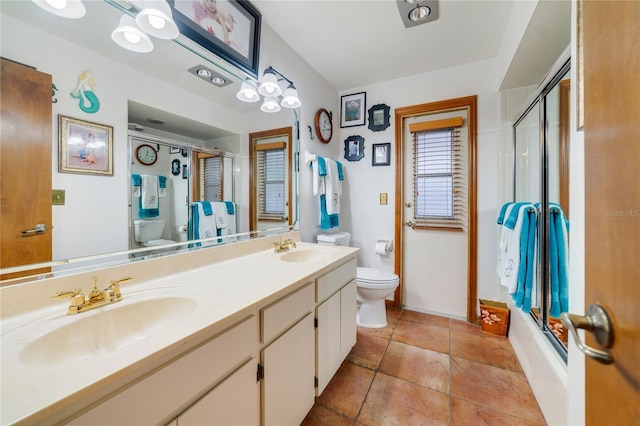 513 Sabal Trail Cir, Longwood, FL 32779 - full bathroom featuring toilet, double vanity, baseboards, and bath / shower combo with glass door