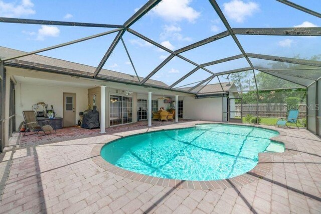 513 Sabal Trail Cir, Longwood, FL 32779 - view of swimming pool featuring a patio area, ceiling fan, and a lanai