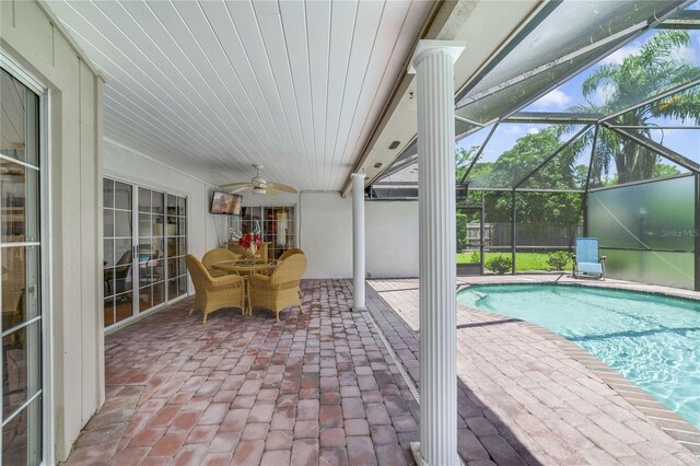 513 Sabal Trail Cir, Longwood, FL 32779 - outdoor pool featuring a patio area, a ceiling fan, outdoor dining area, and a lanai