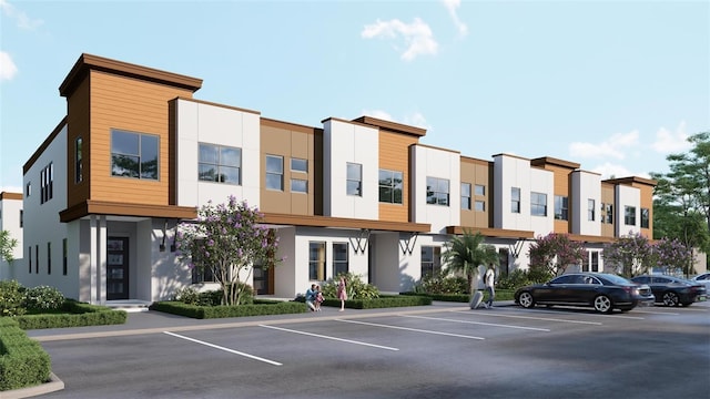 213 Breezeway Dr, Davenport, FL 33897 - view of building exterior featuring uncovered parking and a residential view