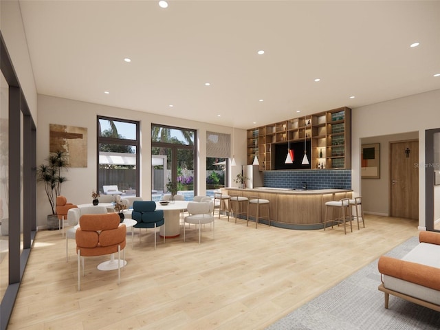 213 Breezeway Dr, Davenport, FL 33897 - living room featuring light wood finished floors and recessed lighting