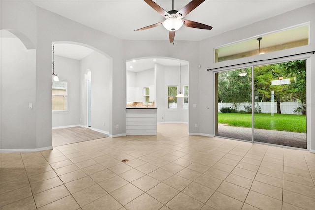 1601 Stargazer Ter, Sanford, FL 32771 - empty room with ceiling fan, plenty of natural light, and baseboards