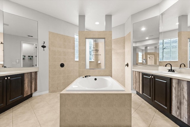 1601 Stargazer Ter, Sanford, FL 32771 - bathroom featuring tile patterned floors, a garden tub, two vanities, and recessed lighting