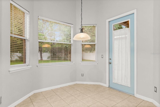 1601 Stargazer Ter, Sanford, FL 32771 - unfurnished dining area with baseboards and light tile patterned flooring