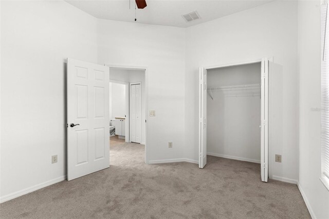 4520 Barrister Dr, Clermont, FL 34711 - unfurnished bedroom with carpet, a closet, a ceiling fan, and baseboards