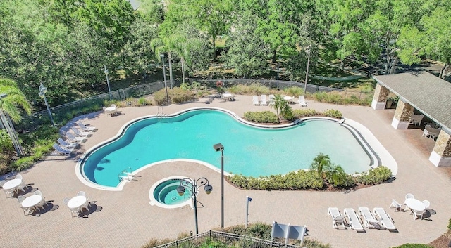 4520 Barrister Dr, Clermont, FL 34711 - community pool featuring a patio area and view of scattered trees