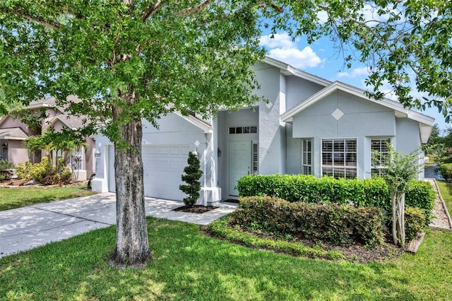 2776 Joseph Cir, Oviedo, FL 32765 - view of front of house with a garage, stucco siding, driveway, and a front lawn