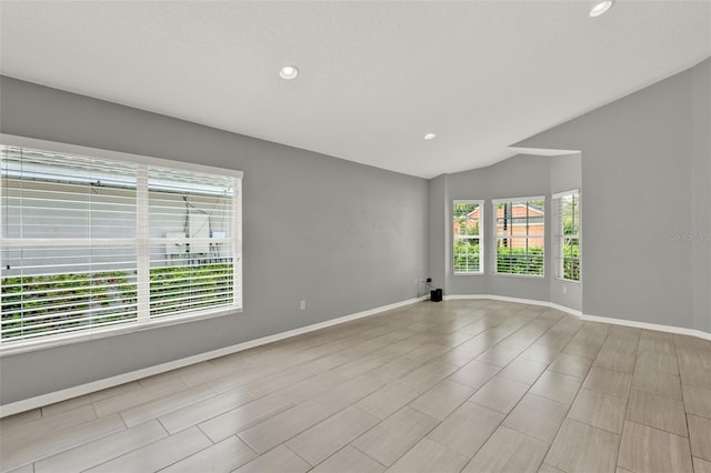 2776 Joseph Cir, Oviedo, FL 32765 - empty room featuring baseboards, recessed lighting, and lofted ceiling