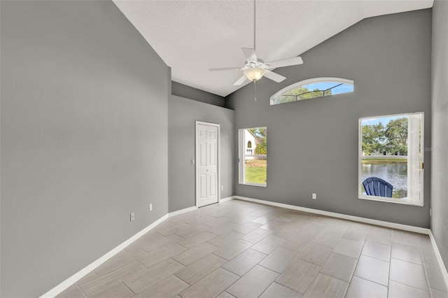 2776 Joseph Cir, Oviedo, FL 32765 - empty room featuring ceiling fan, high vaulted ceiling, baseboards, and a water view