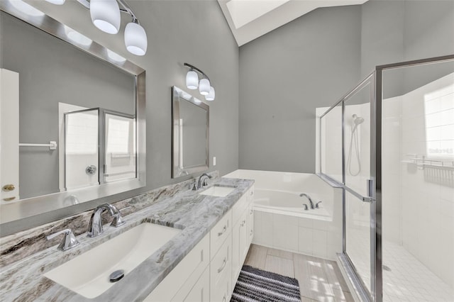 2776 Joseph Cir, Oviedo, FL 32765 - full bath featuring a garden tub, a skylight, a stall shower, double vanity, and vaulted ceiling