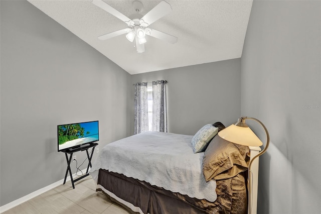 2776 Joseph Cir, Oviedo, FL 32765 - bedroom with vaulted ceiling, a textured ceiling, a ceiling fan, and baseboards
