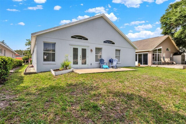 2776 Joseph Cir, Oviedo, FL 32765 - back of property with french doors, a lawn, stucco siding, a patio, and a sunroom
