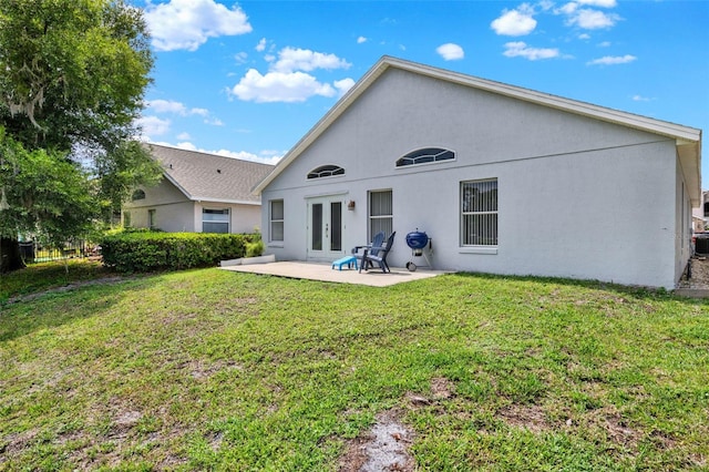 2776 Joseph Cir, Oviedo, FL 32765 - back of house with french doors, a patio, a yard, and stucco siding