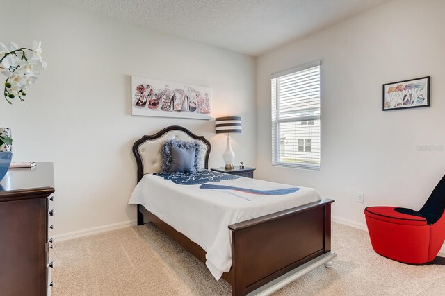 5169 Masser Rd, Saint Cloud, FL 34772 - bedroom featuring carpet floors, baseboards, and a textured ceiling