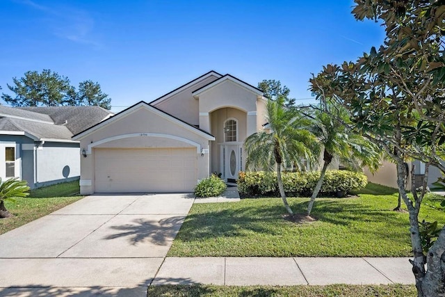 12756 Maribou Cir, Orlando, FL 32828 - view of front of property featuring stucco siding, a garage, a front lawn, and driveway