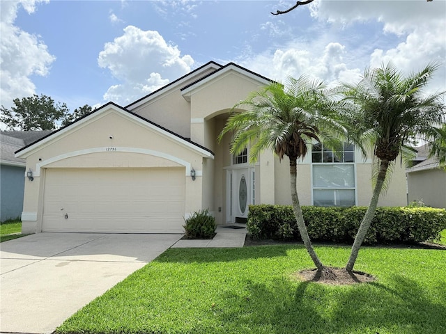 12756 Maribou Cir, Orlando, FL 32828 - view of front of property with stucco siding, a front lawn, driveway, and a garage