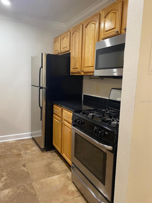 2007 Dixie Belle Dr Unit 2007M, Orlando, FL 32812 - kitchen featuring stainless steel appliances, ornamental molding, dark countertops, and baseboards