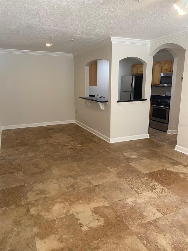 2007 Dixie Belle Dr Unit 2007M, Orlando, FL 32812 - unfurnished room featuring a textured ceiling, baseboards, and crown molding