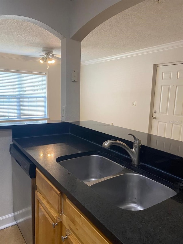 2007 Dixie Belle Dr Unit 2007M, Orlando, FL 32812 - kitchen featuring a textured ceiling, stainless steel dishwasher, a sink, ornamental molding, and arched walkways
