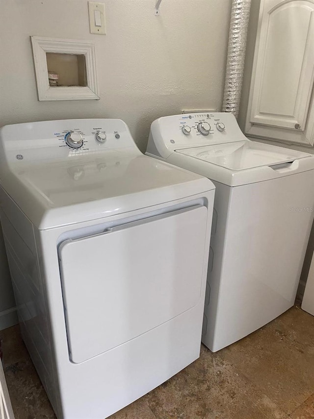2007 Dixie Belle Dr Unit 2007M, Orlando, FL 32812 - washroom with cabinet space and separate washer and dryer