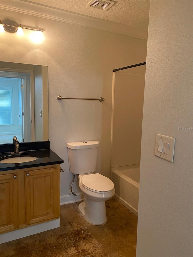 2007 Dixie Belle Dr Unit 2007M, Orlando, FL 32812 - full bath with vanity, toilet, a textured ceiling, bathing tub / shower combination, and baseboards