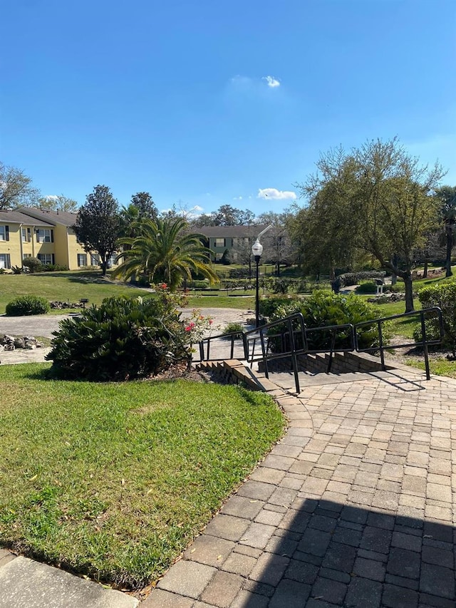 2007 Dixie Belle Dr Unit 2007M, Orlando, FL 32812 - view of property's community with a lawn
