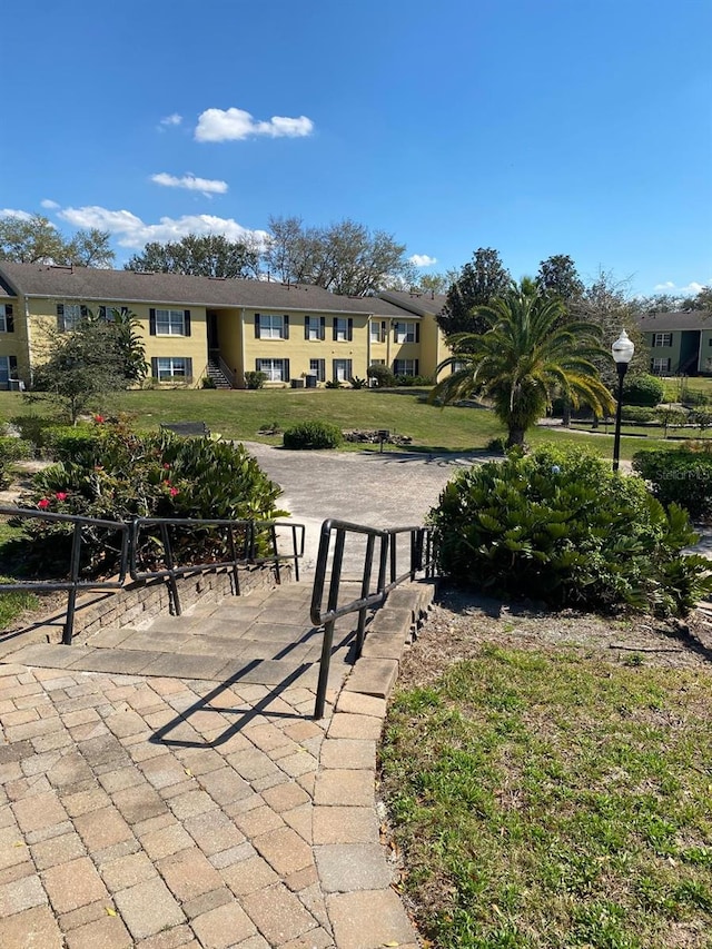 2007 Dixie Belle Dr Unit 2007M, Orlando, FL 32812 - view of community with a lawn