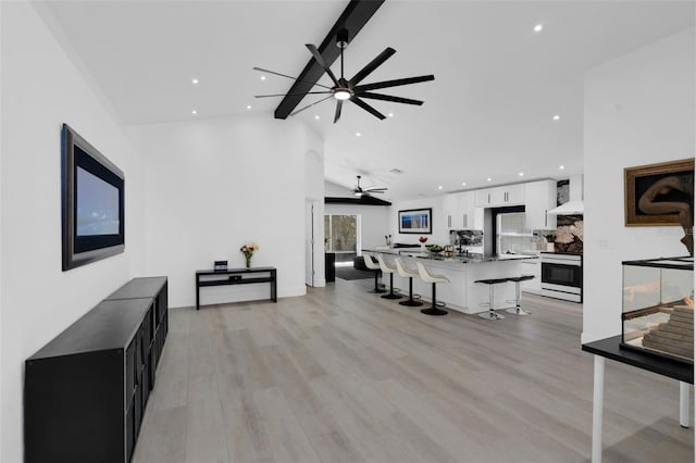 2520 Oakington St, Winter Garden, FL 34787 - living area featuring ceiling fan, recessed lighting, light wood-type flooring, and high vaulted ceiling