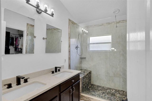 2520 Oakington St, Winter Garden, FL 34787 - bathroom featuring tiled shower, double vanity, a spacious closet, and lofted ceiling