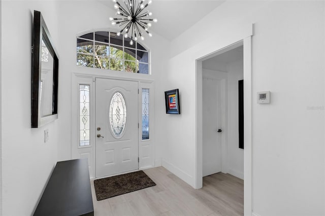 2520 Oakington St, Winter Garden, FL 34787 - entryway featuring a chandelier, light wood finished floors, and baseboards