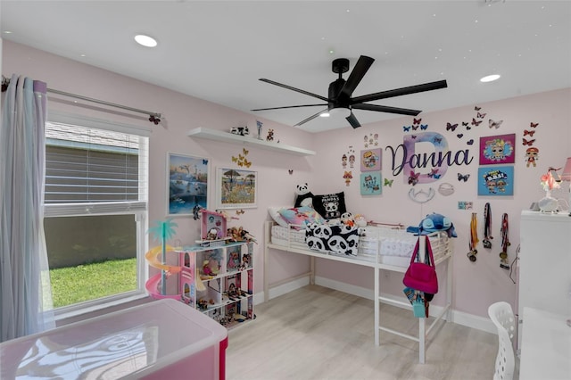 2520 Oakington St, Winter Garden, FL 34787 - bedroom with wood finished floors, multiple windows, baseboards, and recessed lighting