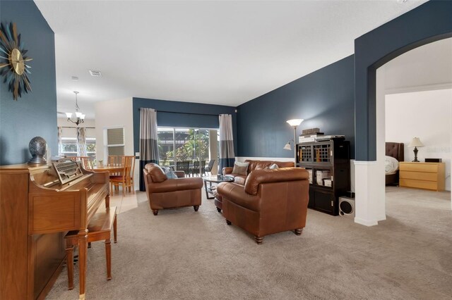 2801 Boat Cove Cir, Kissimmee, FL 34746 - carpeted living area featuring arched walkways and a chandelier