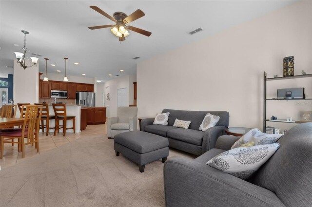 2801 Boat Cove Cir, Kissimmee, FL 34746 - living room with a ceiling fan, light tile patterned flooring, a chandelier, and recessed lighting