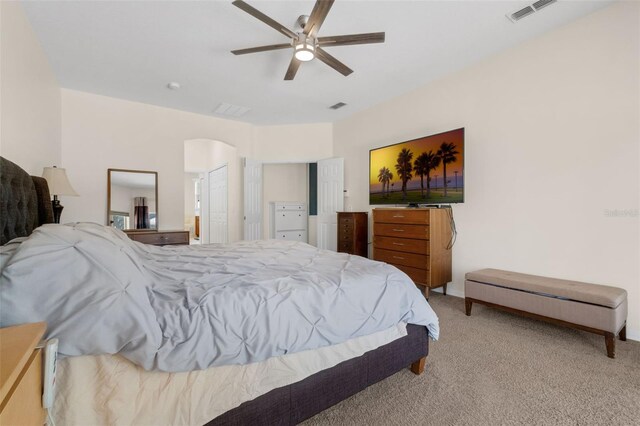 2801 Boat Cove Cir, Kissimmee, FL 34746 - bedroom featuring light carpet, ceiling fan, and arched walkways